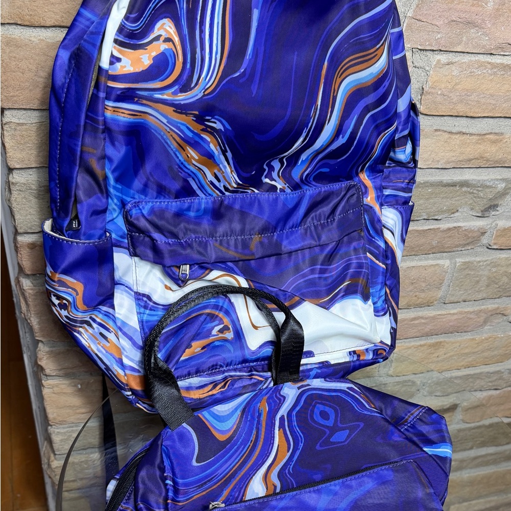 Purple black swirl design on 3 piece backpack, lunch bag and pencil case. Meijer
